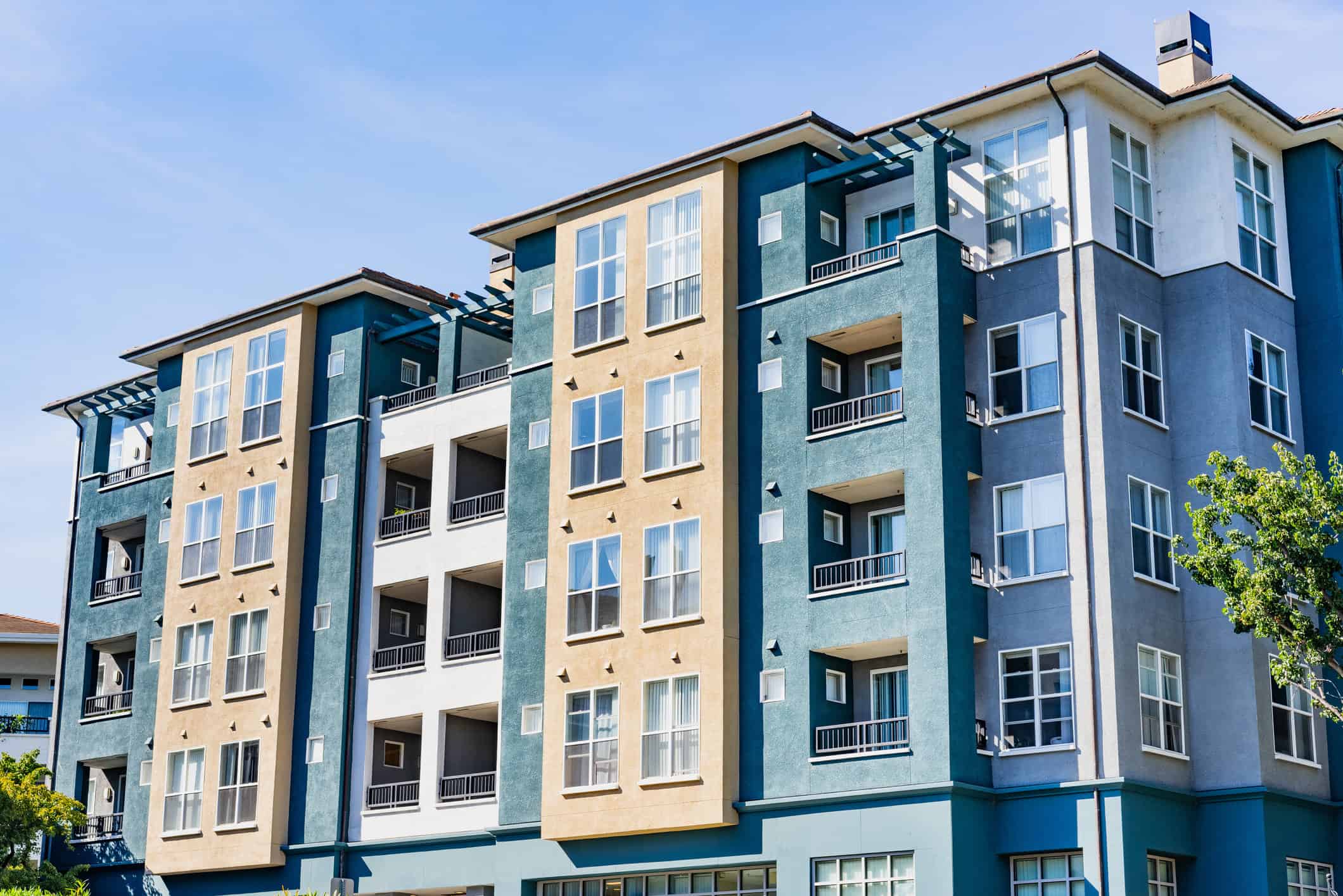 Exterior view of modern apartment building offering luxury rental units in Silicon Valley